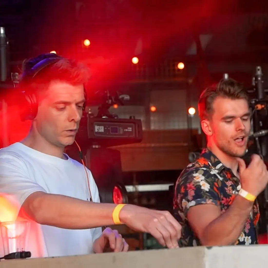 Laurentius playing back to back with Deepend behind the Pioneer DJ decks at a festival